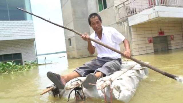 江西鄱阳等洪水退去的人:近百亩农田被淹致欠债,可能要外出打工