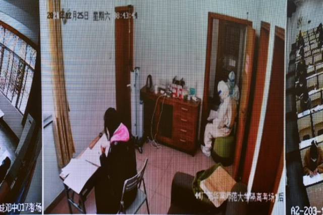考生在隔离考场参加考试(广东省教育考试院指挥监控中心监控画面)。 考生在隔离考场参加考试(广东省教育考试院指挥监控中心监控画面)。